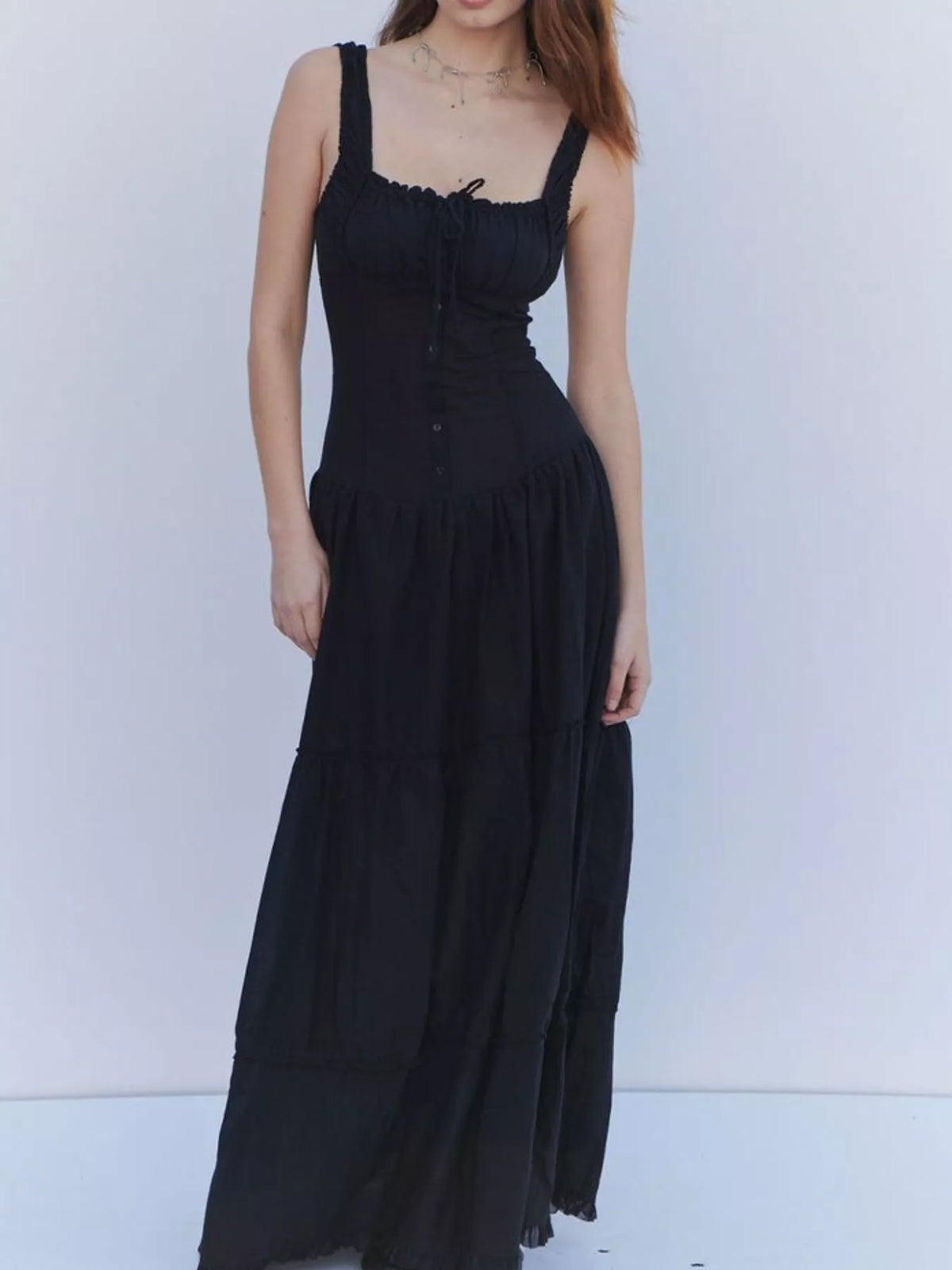 Black square-neck tiered maxi dress with button placket and gathered skirt tiers