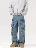 Blue washed cargo jeans with multiple flap pockets, wide straight legs