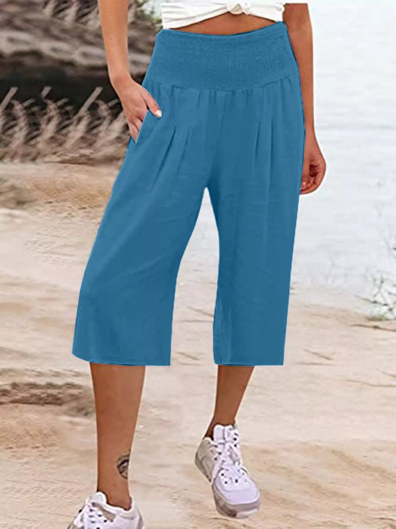 Smocked wide-leg capri pants in teal blue with elastic smocked waistband