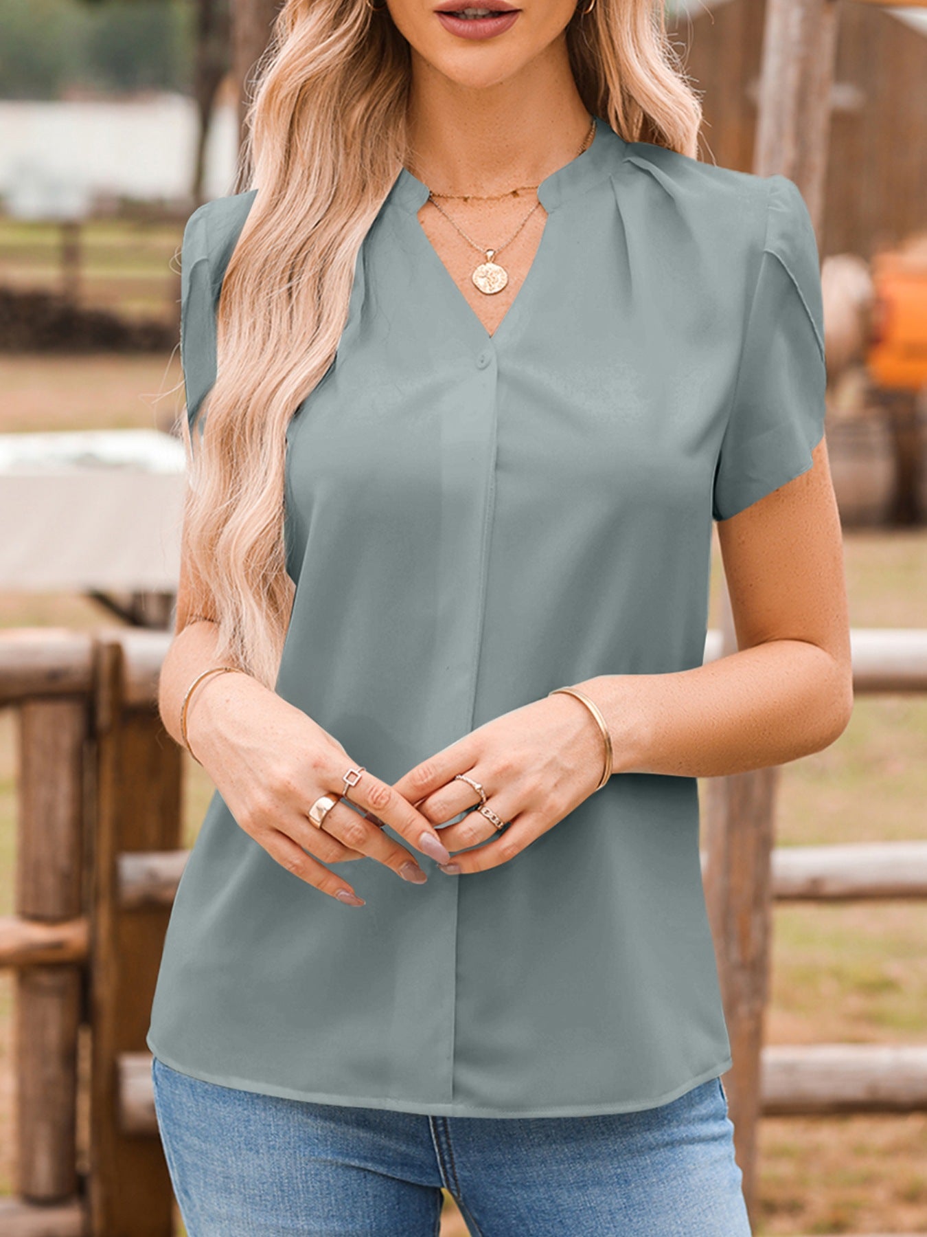 Notched-neckline petal-sleeve blouse in blue-gray, versatile women's top