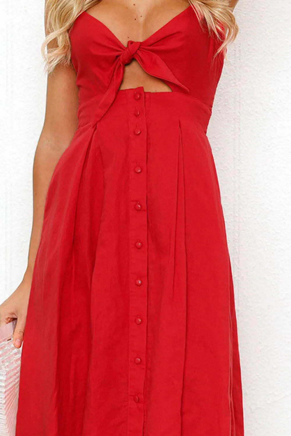 Red cami dress close-up with sweetheart bow cutout and buttoned front