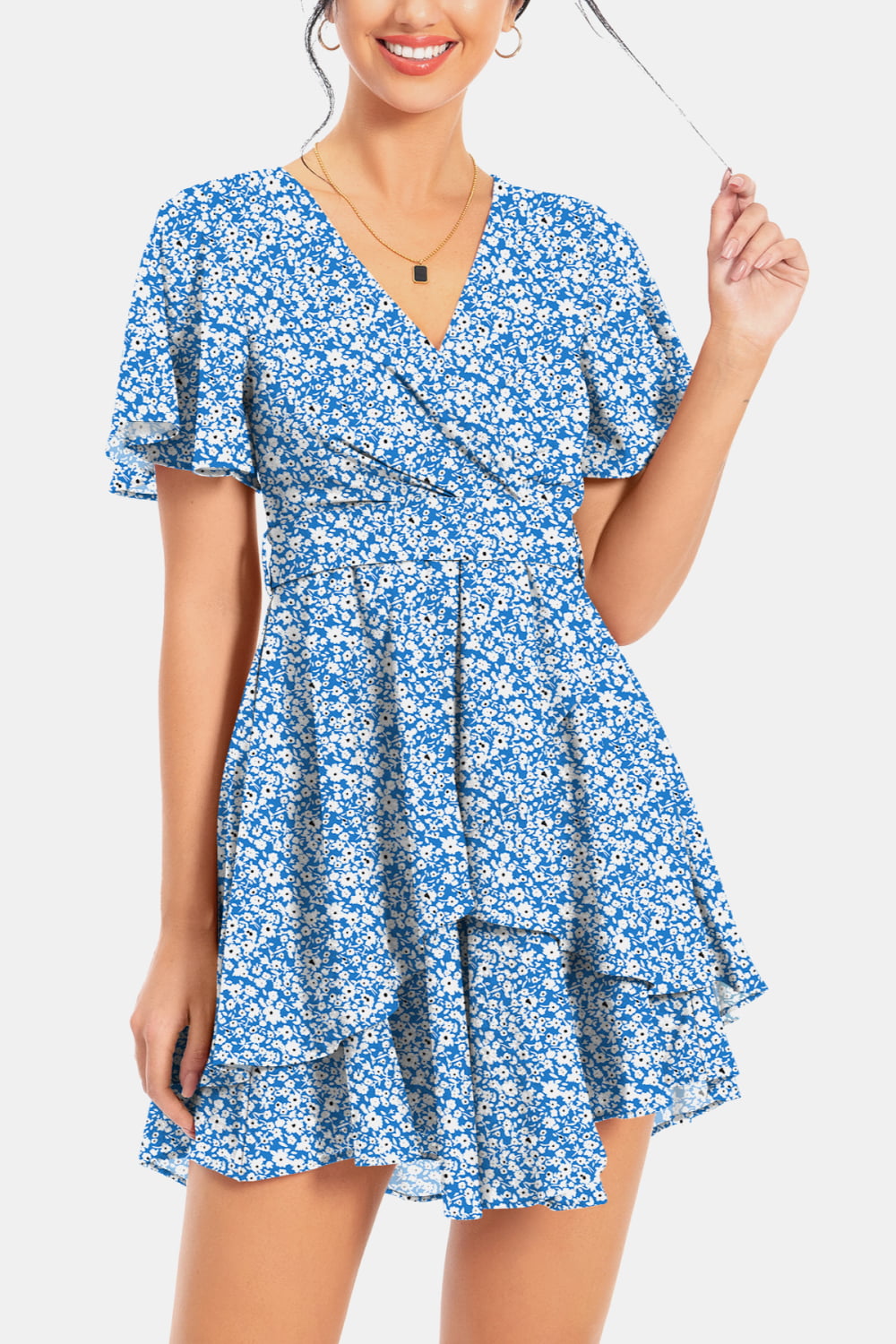 Blue floral surplice mini dress with flutter sleeves and tiered skirt