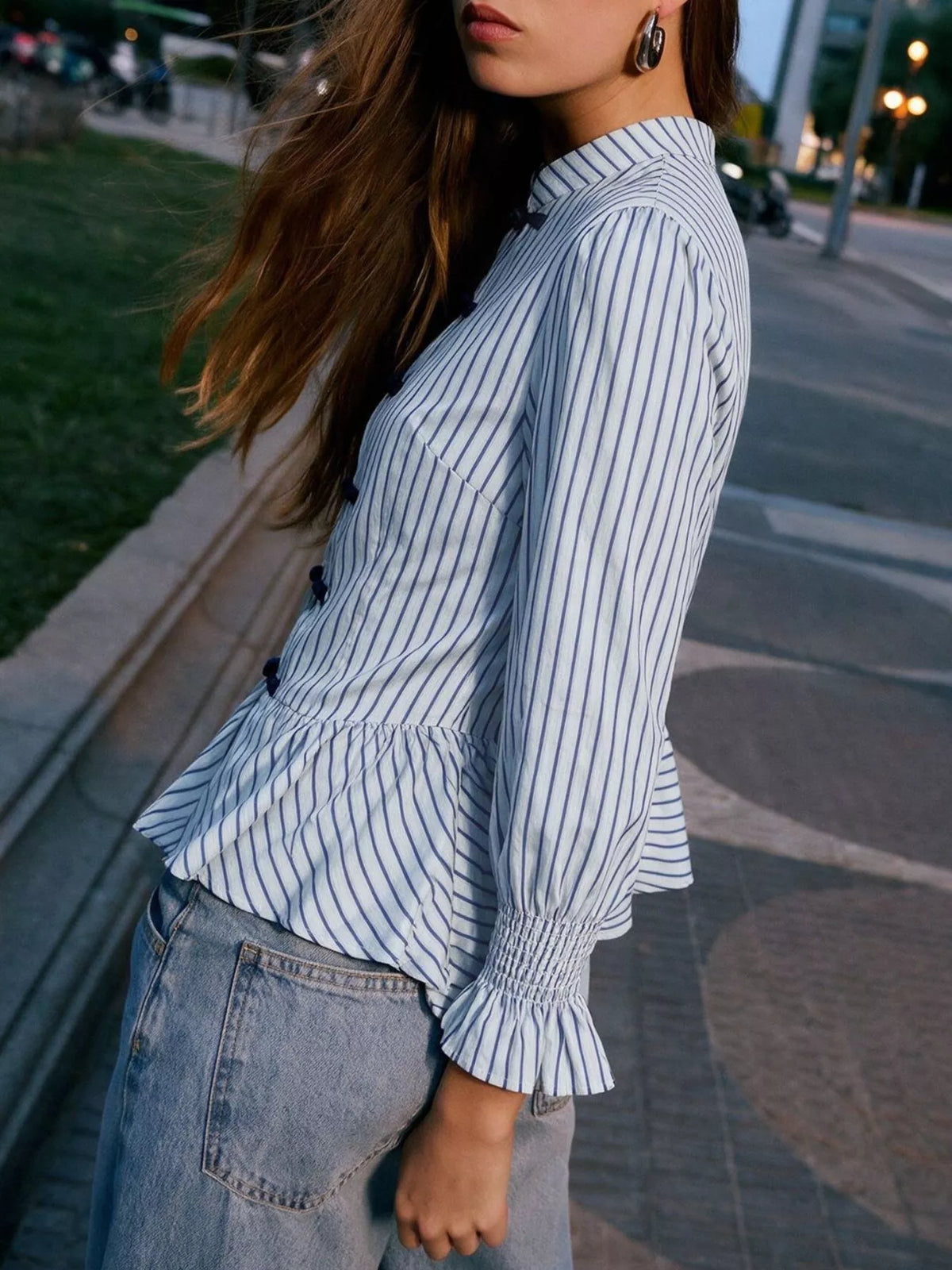 Womens blue-and-white striped mandarin peplum knot shirt with long puff sleeves and toggles