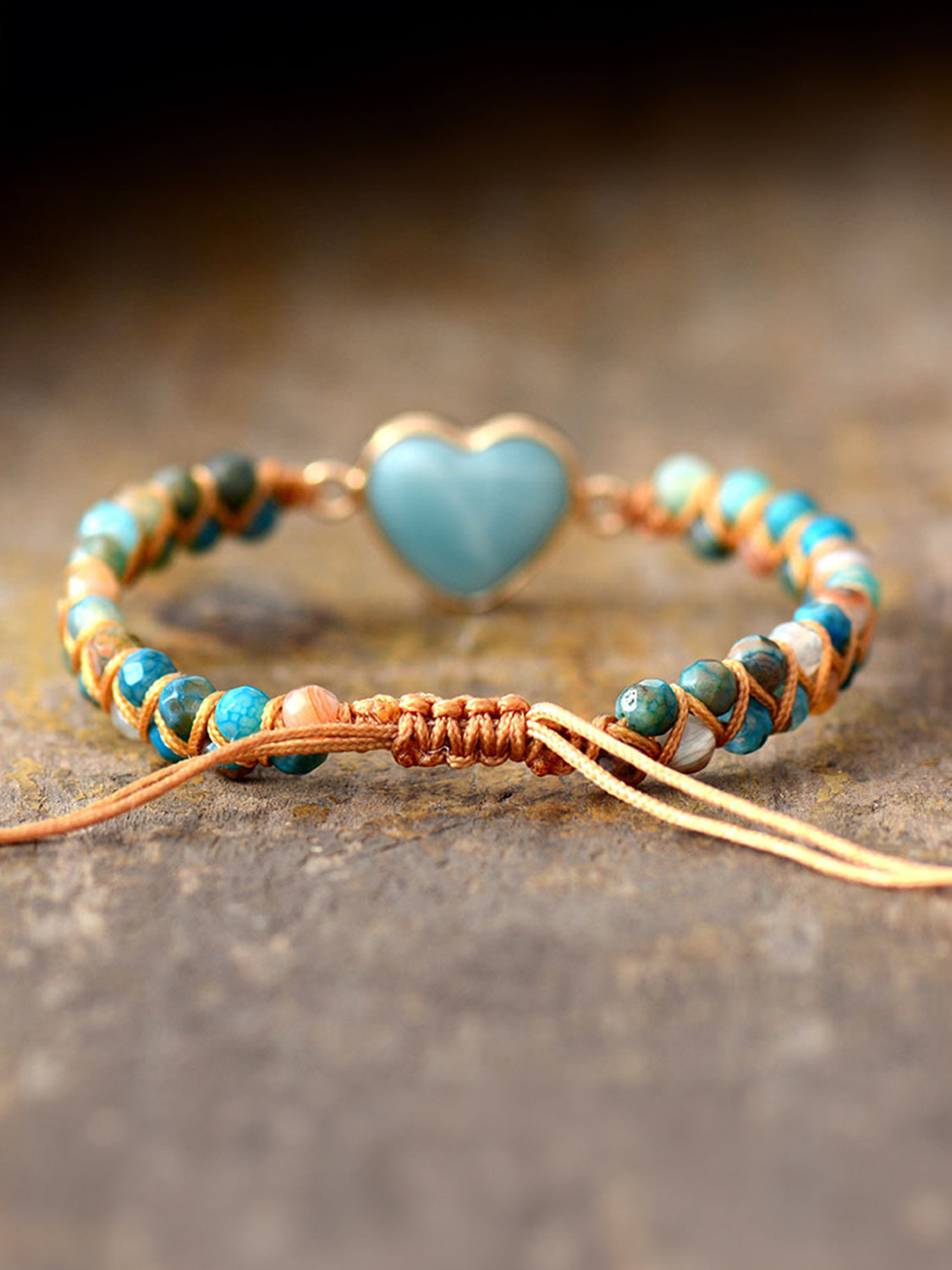Heart beaded bracelet with light blue heart centerpiece, turquoise and orange woven beads