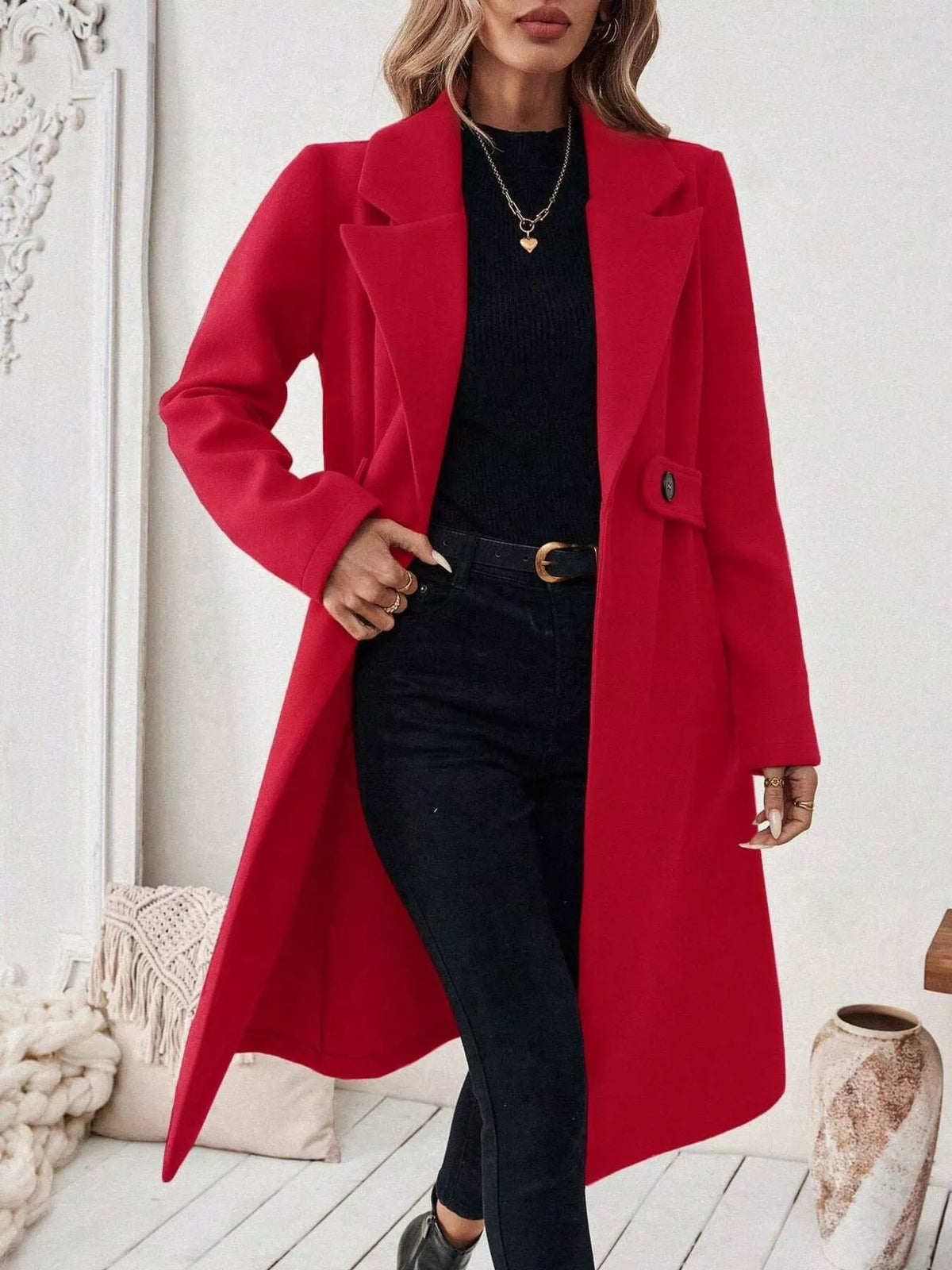 Women's red longline coat with button-front, notch lapels, flap pockets.