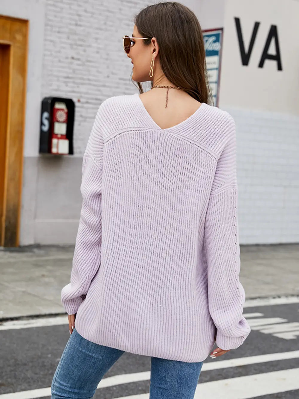 Lavender long sleeve sweater, back view, dropped shoulders with ribbed knit sleeves
