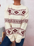 White round-neck sweater with red snowflake Fair Isle pattern across chest and sleeves