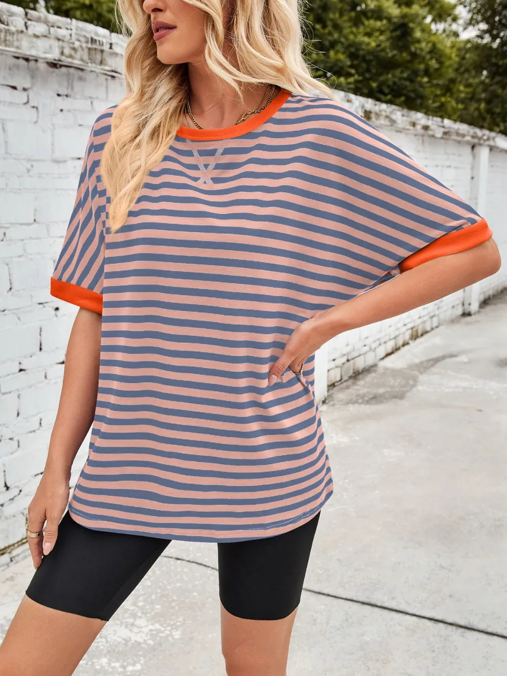 Striped round-neck half-sleeve T-shirt in peach with orange horizontal stripes