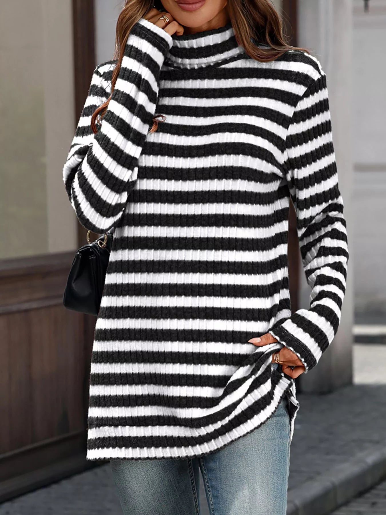 Black and white striped knit turtleneck top, long sleeves, ribbed collar detail.