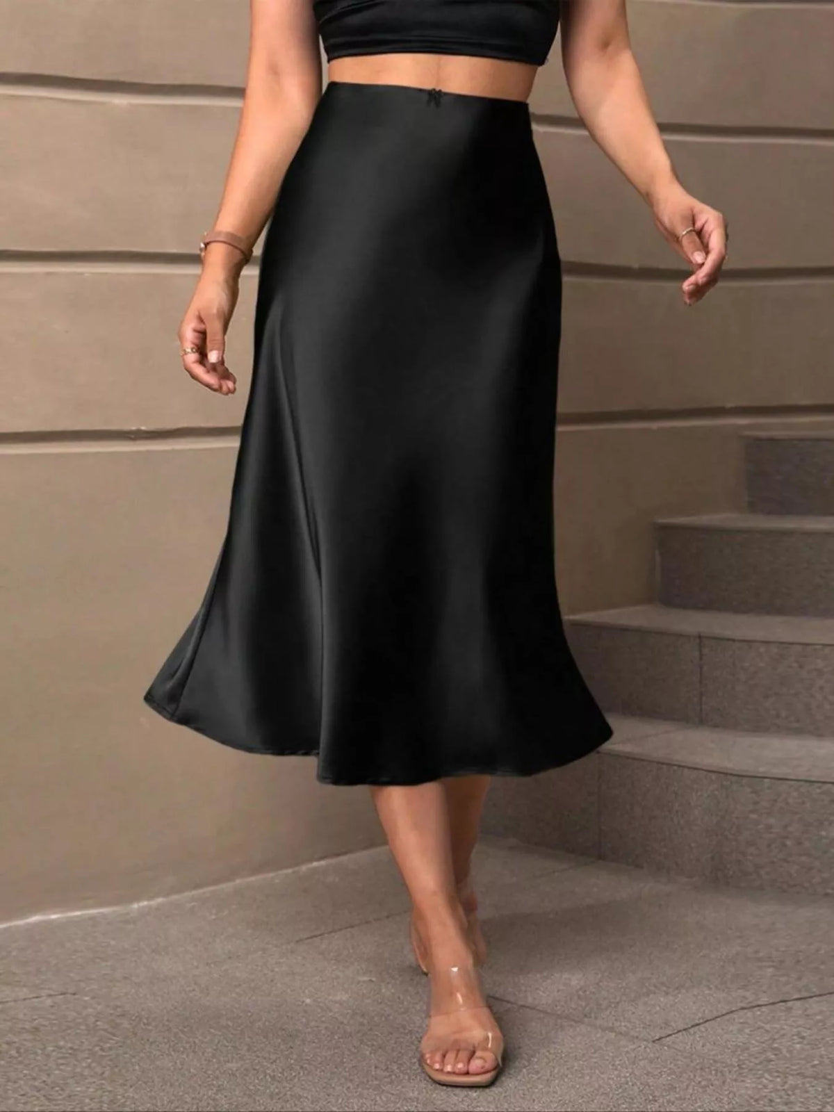 Black satin midi skirt with smooth drape and flared hem
