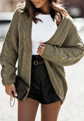 Olive cable-knit open-front cardigan with roomy sleeves and ribbed cuffs