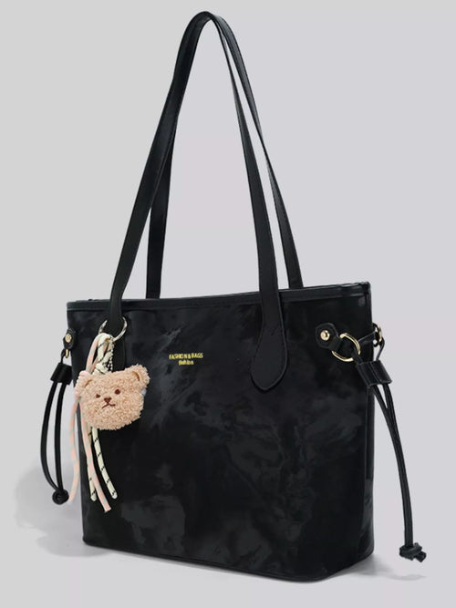 Black bear charm shoulder bag with long straps and side drawcord tassels