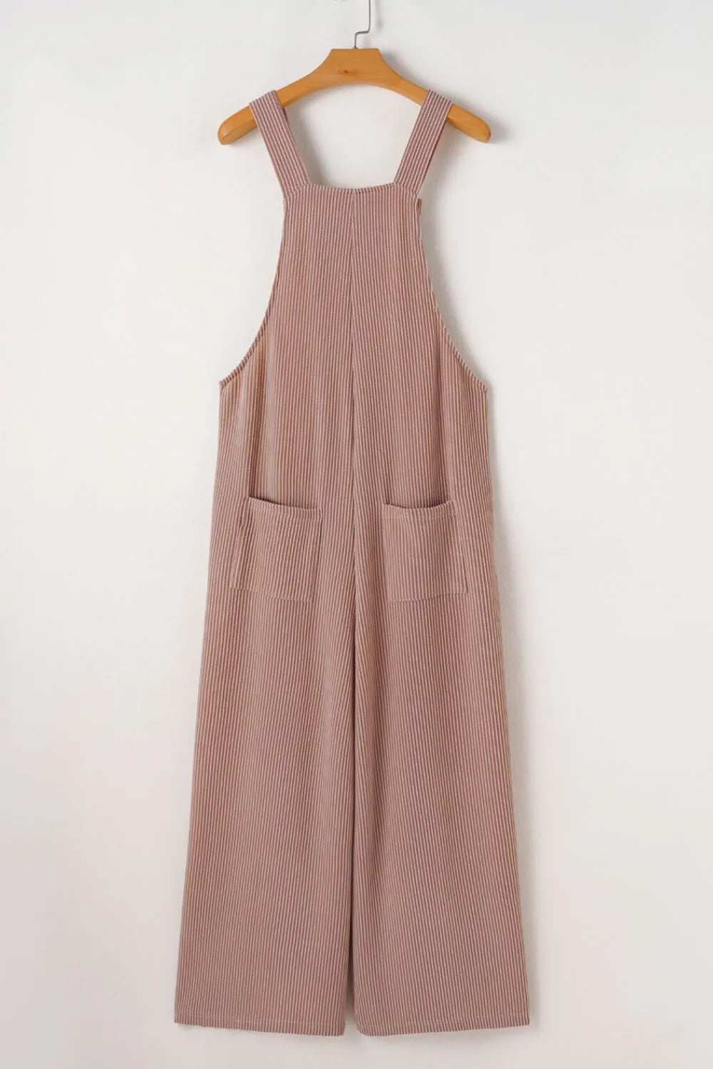 Dusty mauve wide-leg overalls on a hanger with two front pockets and wide legs