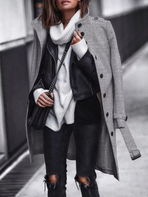 Dark gray longline coat with belt, large buttons, open front over dark jeans