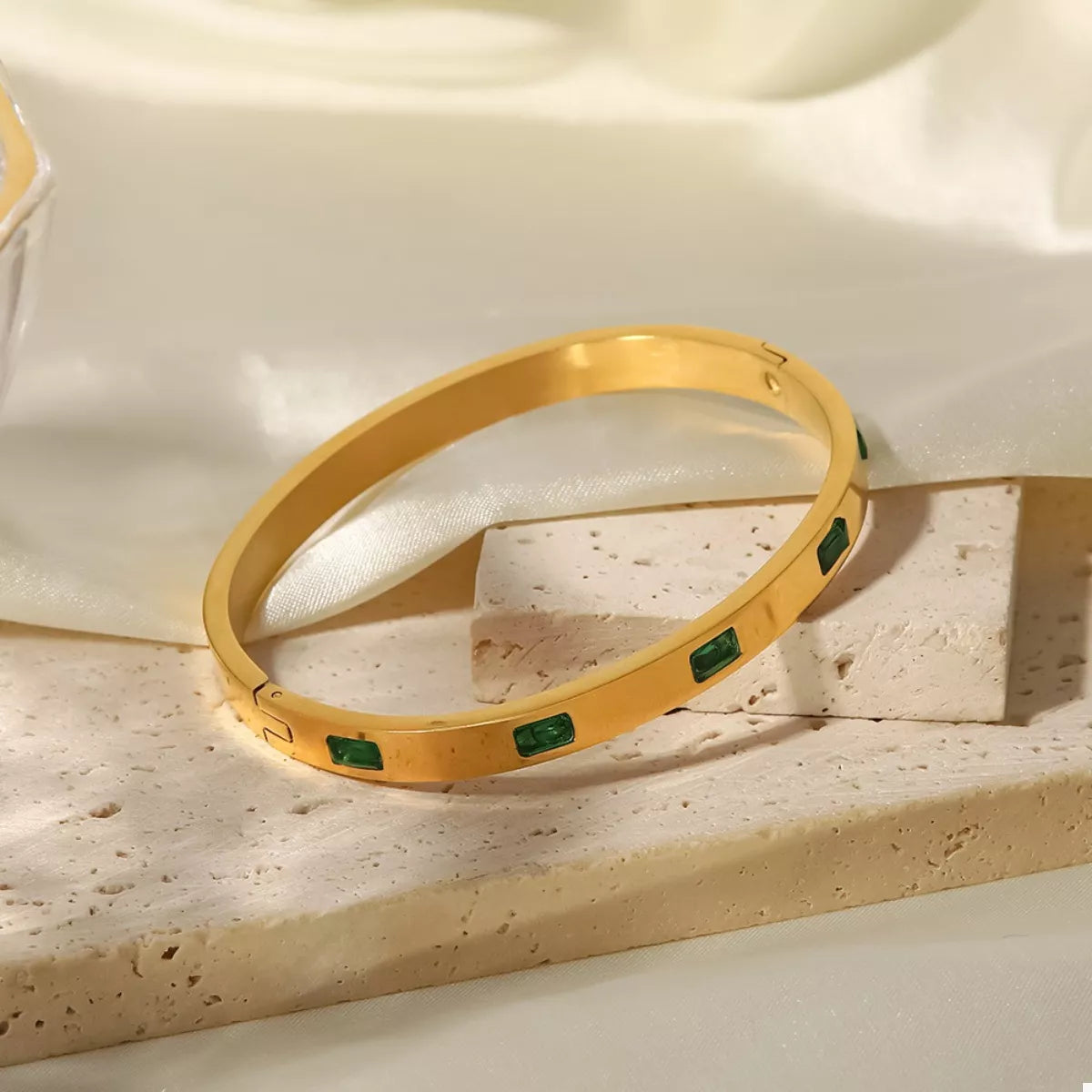 Gold-plated bangle bracelet with green square enamel insets