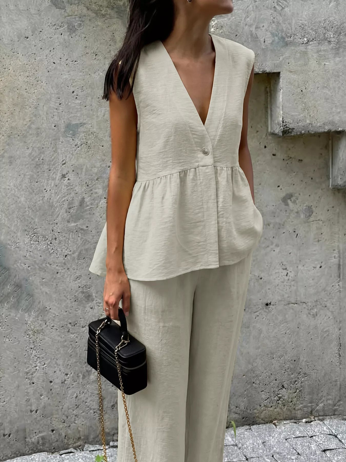 Beige sleeveless peplum V-neck button top with wide-leg pants set