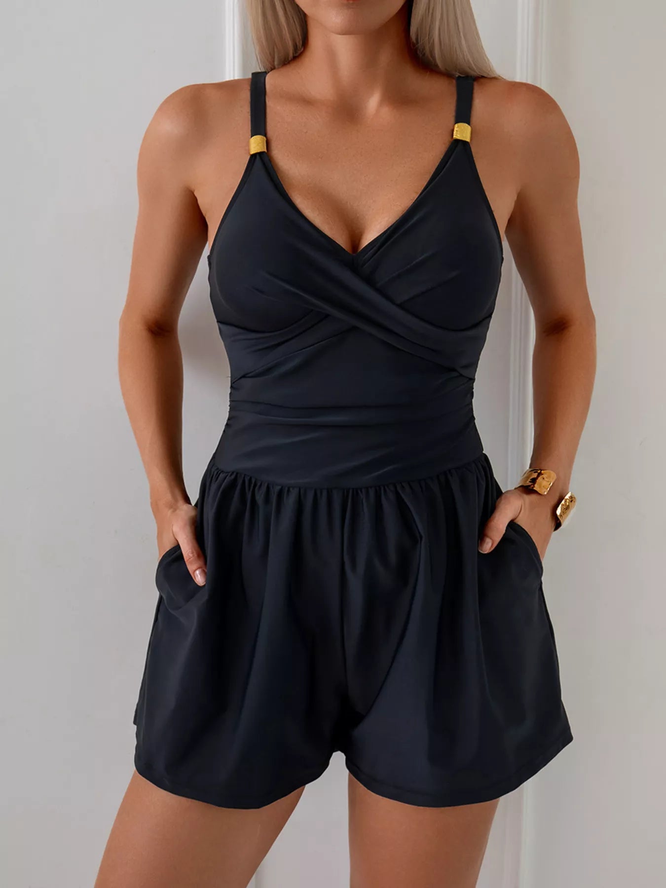 V-Neck Spaghetti Strap One-Piece Swimsuit in black with pocketed chest.