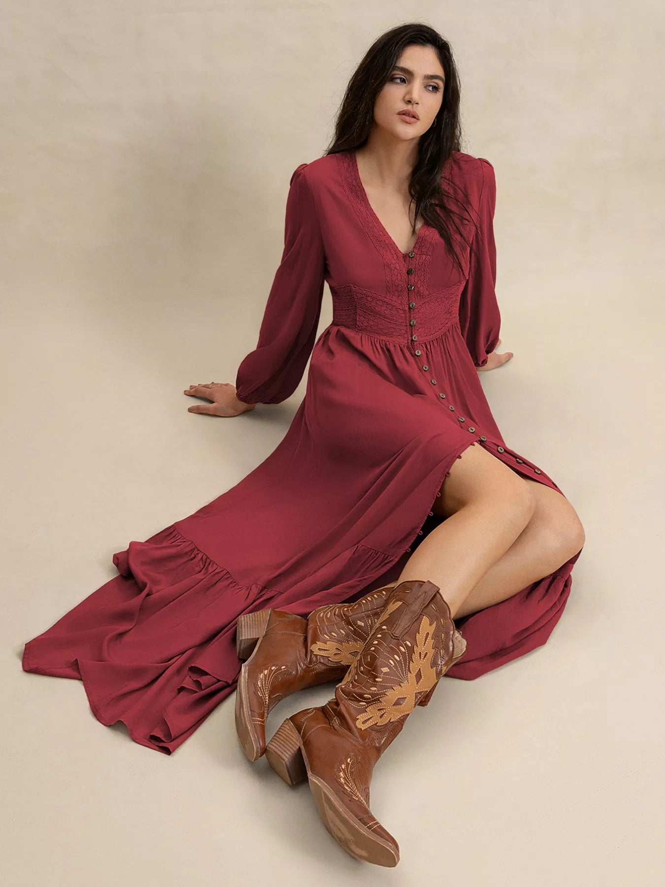 Burgundy V-neck maxi dress with button-front bodice, long balloon sleeves, and side slit