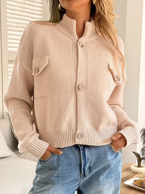 Apricot button-up knit cardigan with standing ribbed collar, button placket, flap pockets