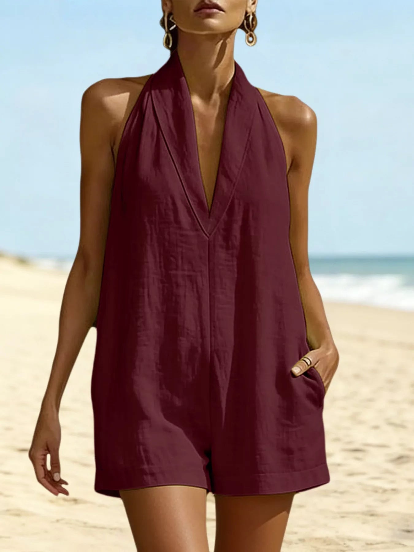 Burgundy halter-neck romper with V neckline and front pockets, short legs