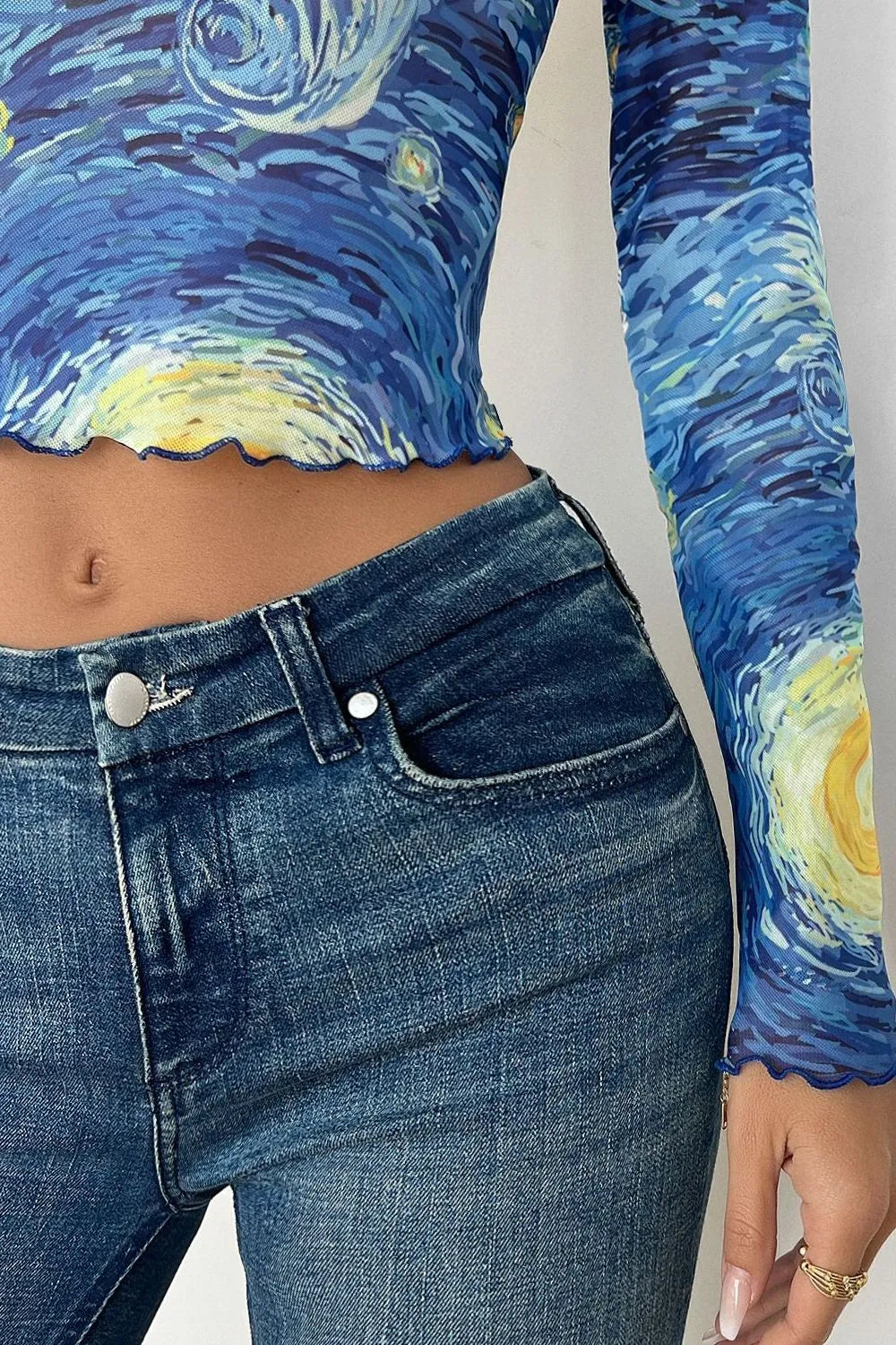 Cropped mesh t-shirt with blue jeans, blue with yellow swirl print, ruffled hem