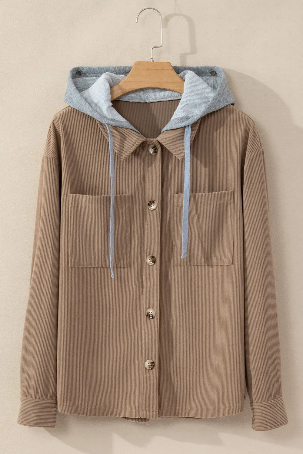 Mocha button-up hooded jacket on hanger with chest pockets and long sleeves