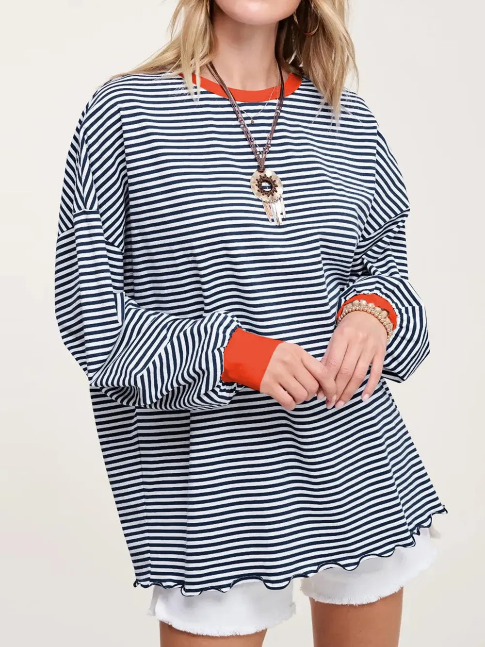 Contrast striped long sleeve sweatshirt in black and white with orange contrast neckline