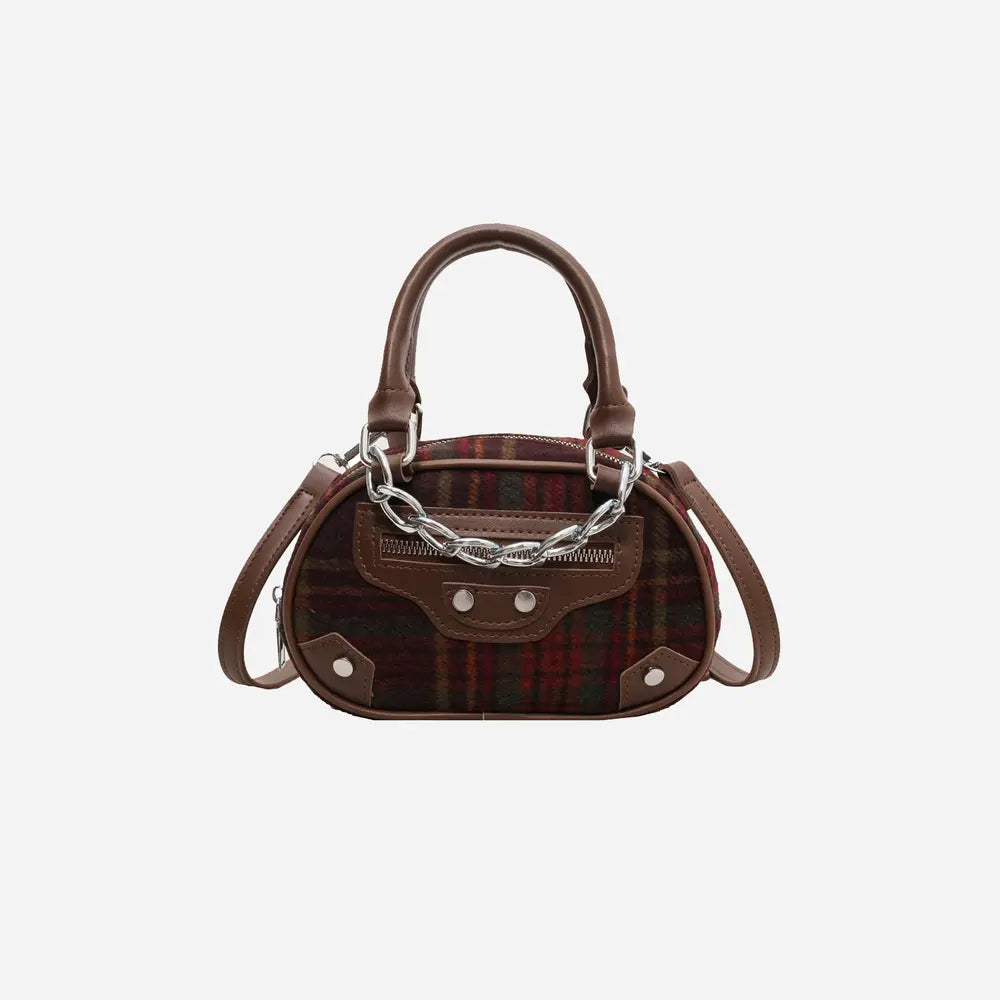 Plaid crossbody bag in brown tones with front flap, snap buttons, and chain strap