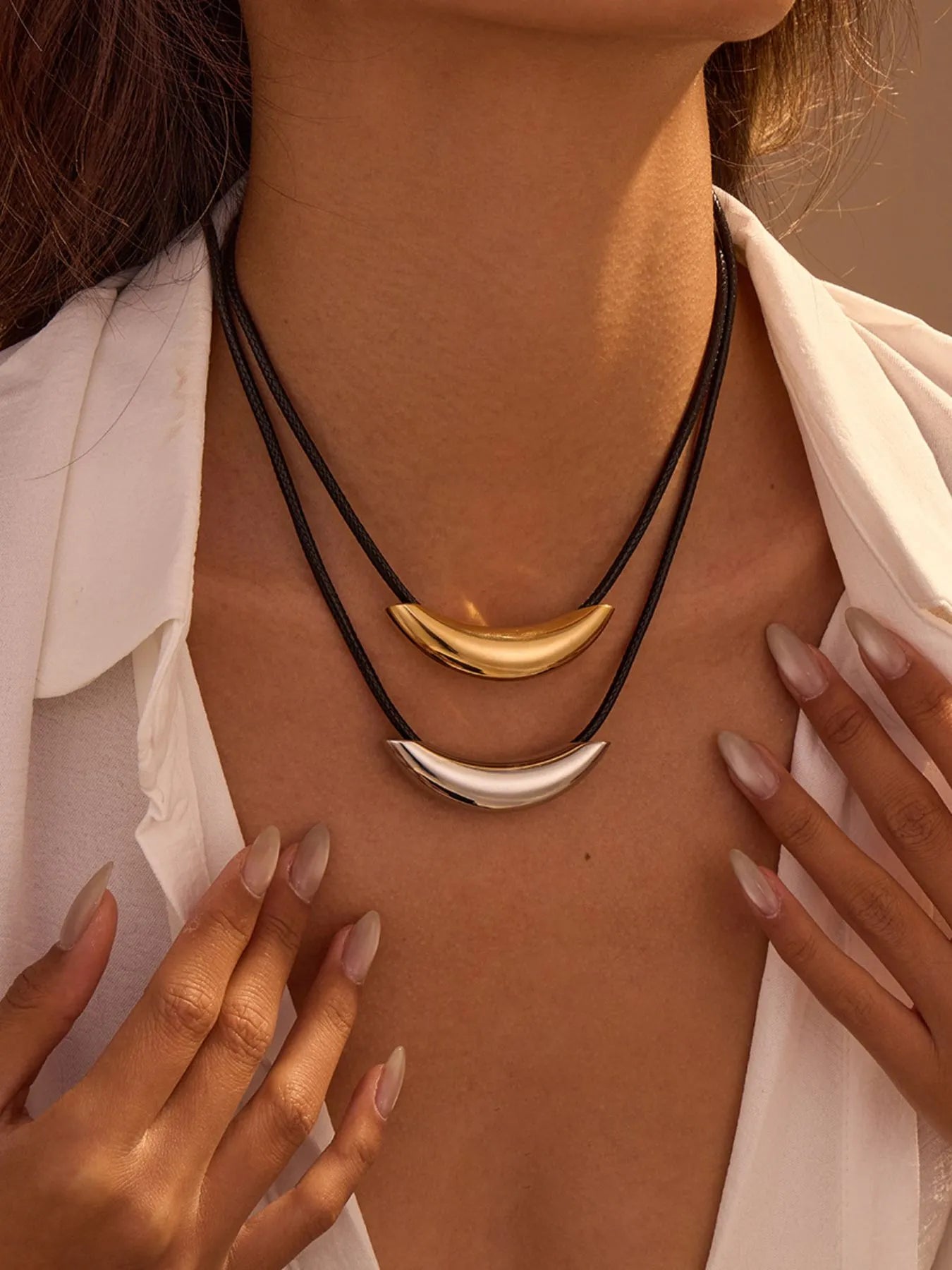 Two-tone curved bar pendant necklace with black leather rope
