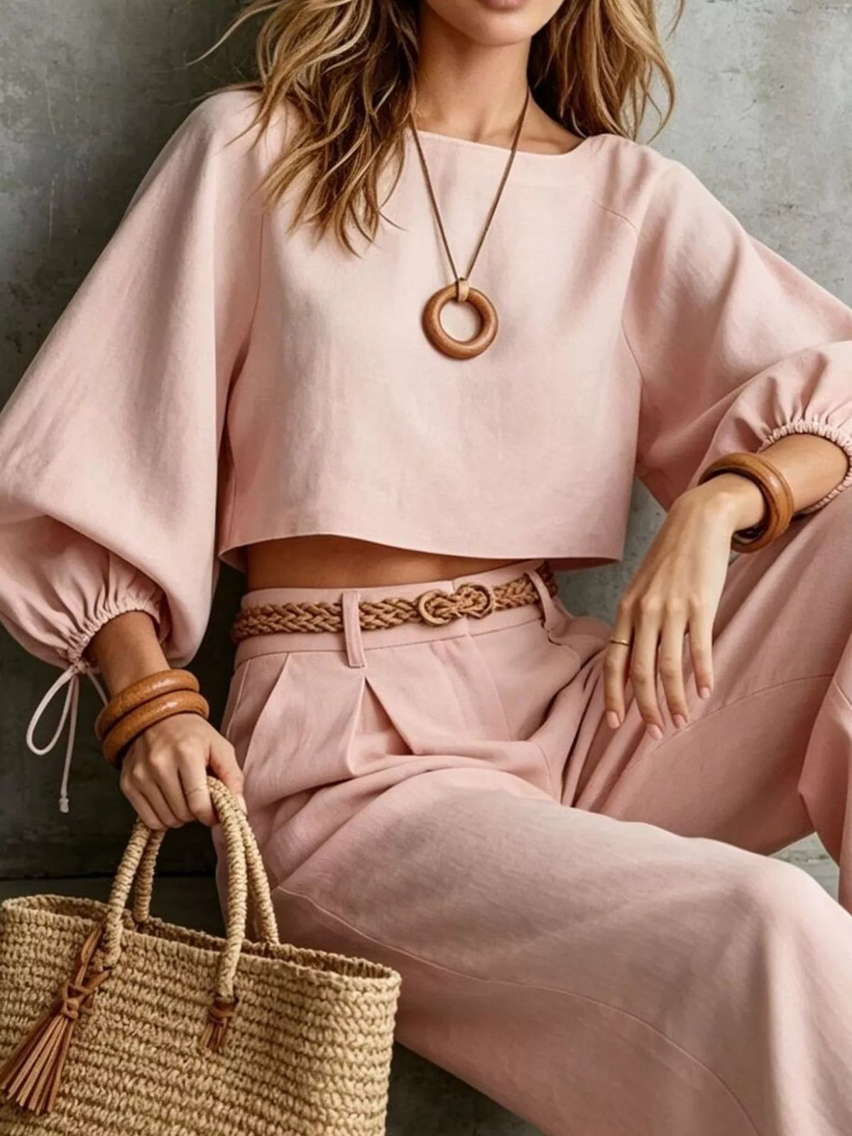 Dusty pink two-piece set with balloon-sleeve cropped top and wide-leg pants