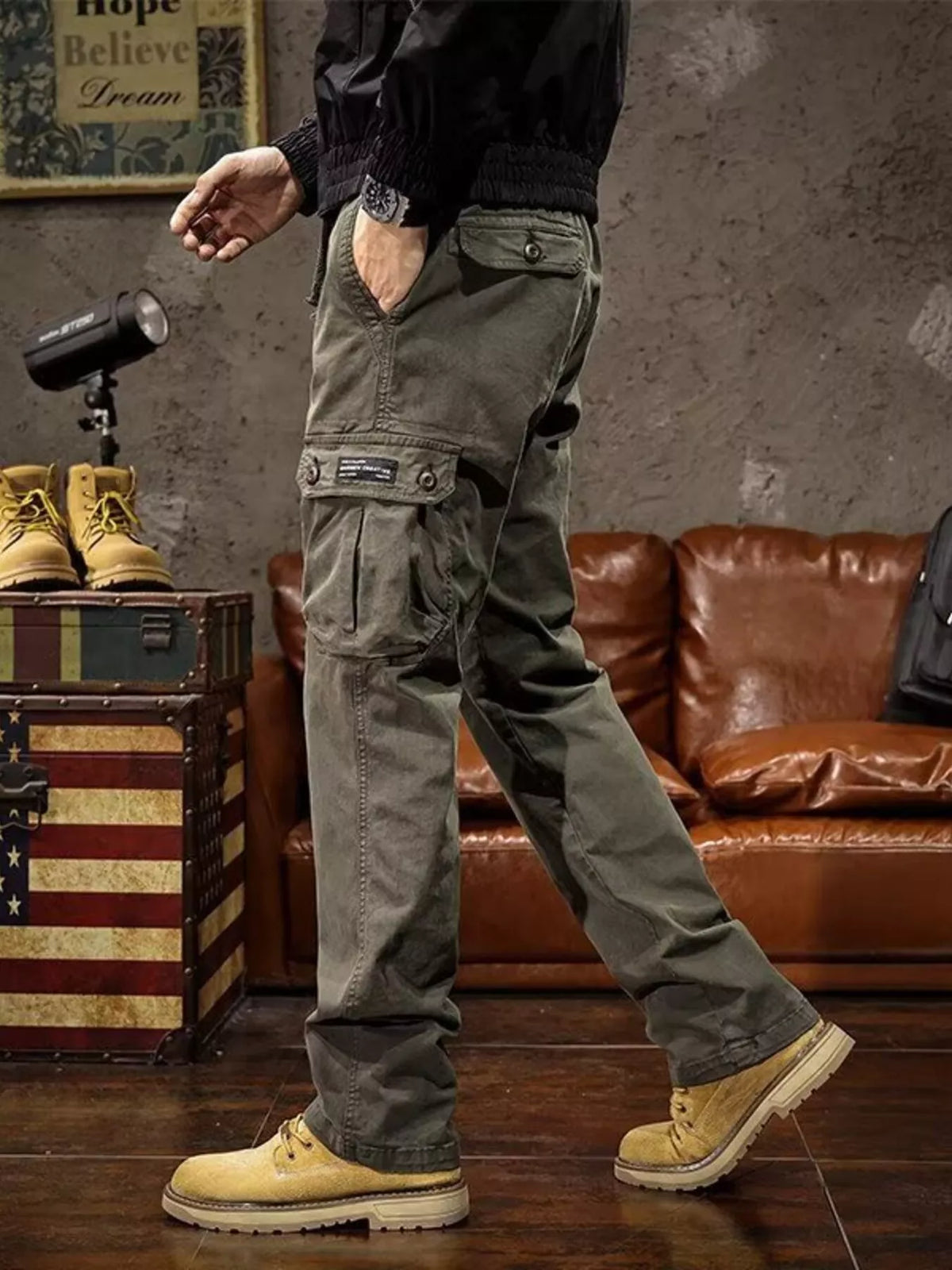 Mens multi-pocket drawstring cargo pants in olive green with flap side pockets