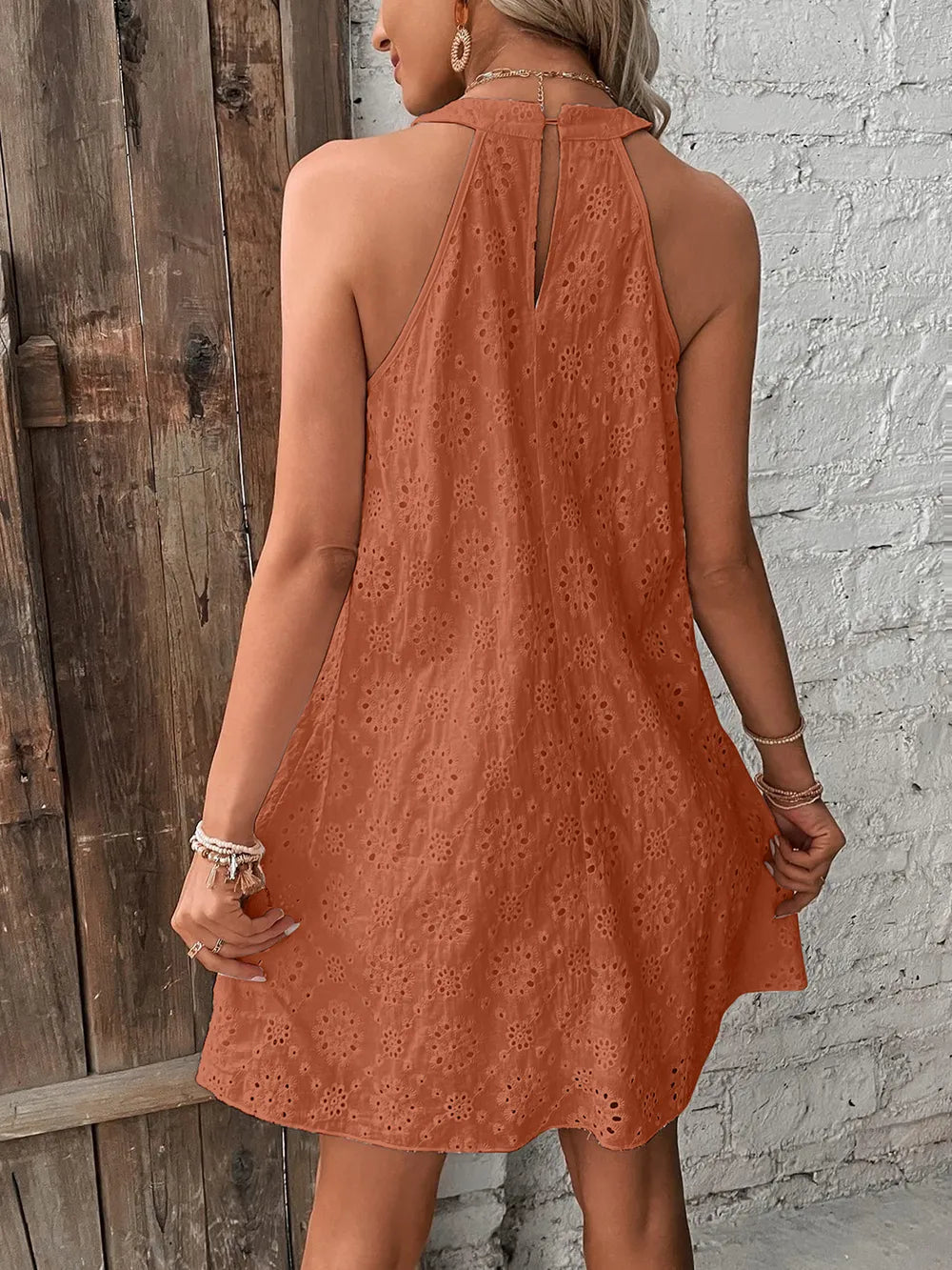 Caramel eyelet mini dress back view with high halter neckline and open back