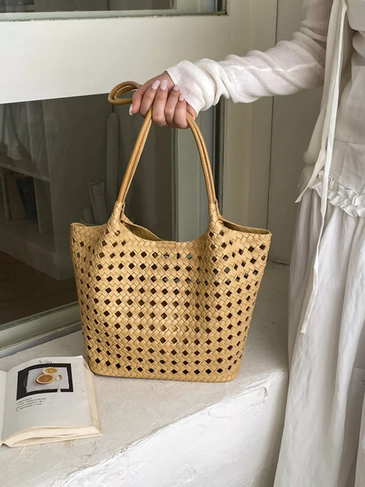 Tan woven vegan leather medium shoulder bag with top handles and long strap