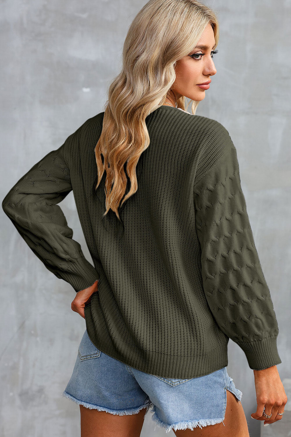 Army green V-neck sweater with cream contrast trim and textured long sleeves
