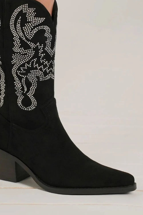 Side view of black point-toe ankle boots with rhinestone pattern and block heel