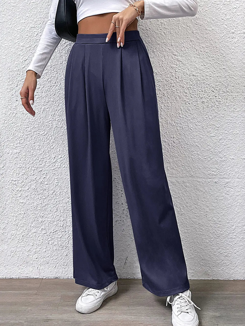 High-waist straight navy pants with front pleats and wide-leg fit