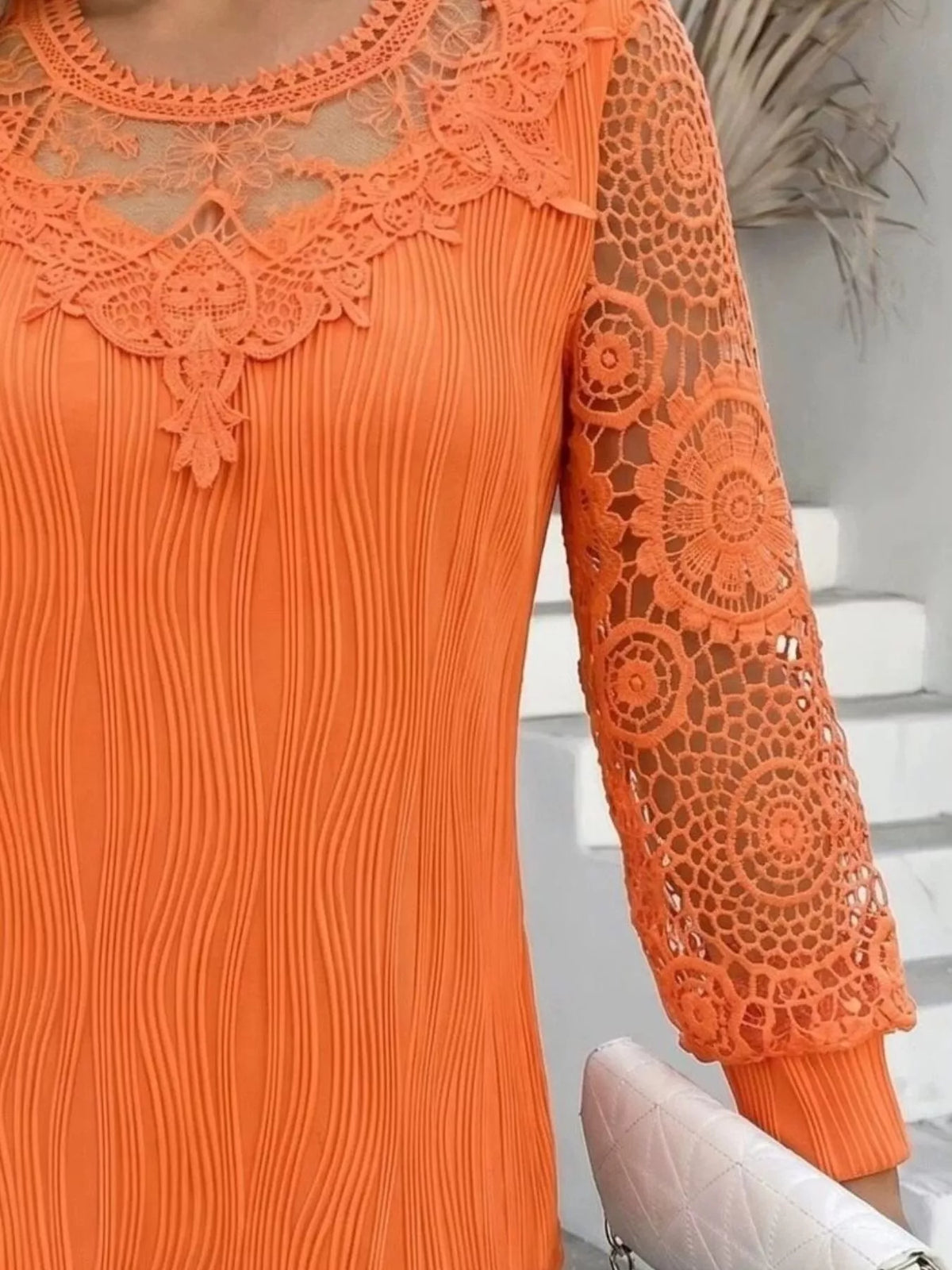 Orange lace patchwork long-sleeve blouse with lace panel sleeves and decorative yoke