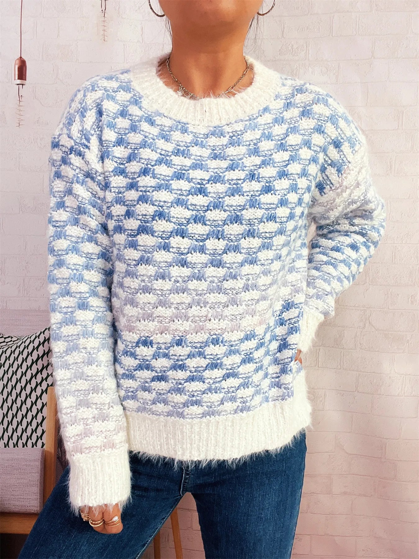 Blue and cream patterned round neck sweater, long sleeves with ribbed cuffs and hem