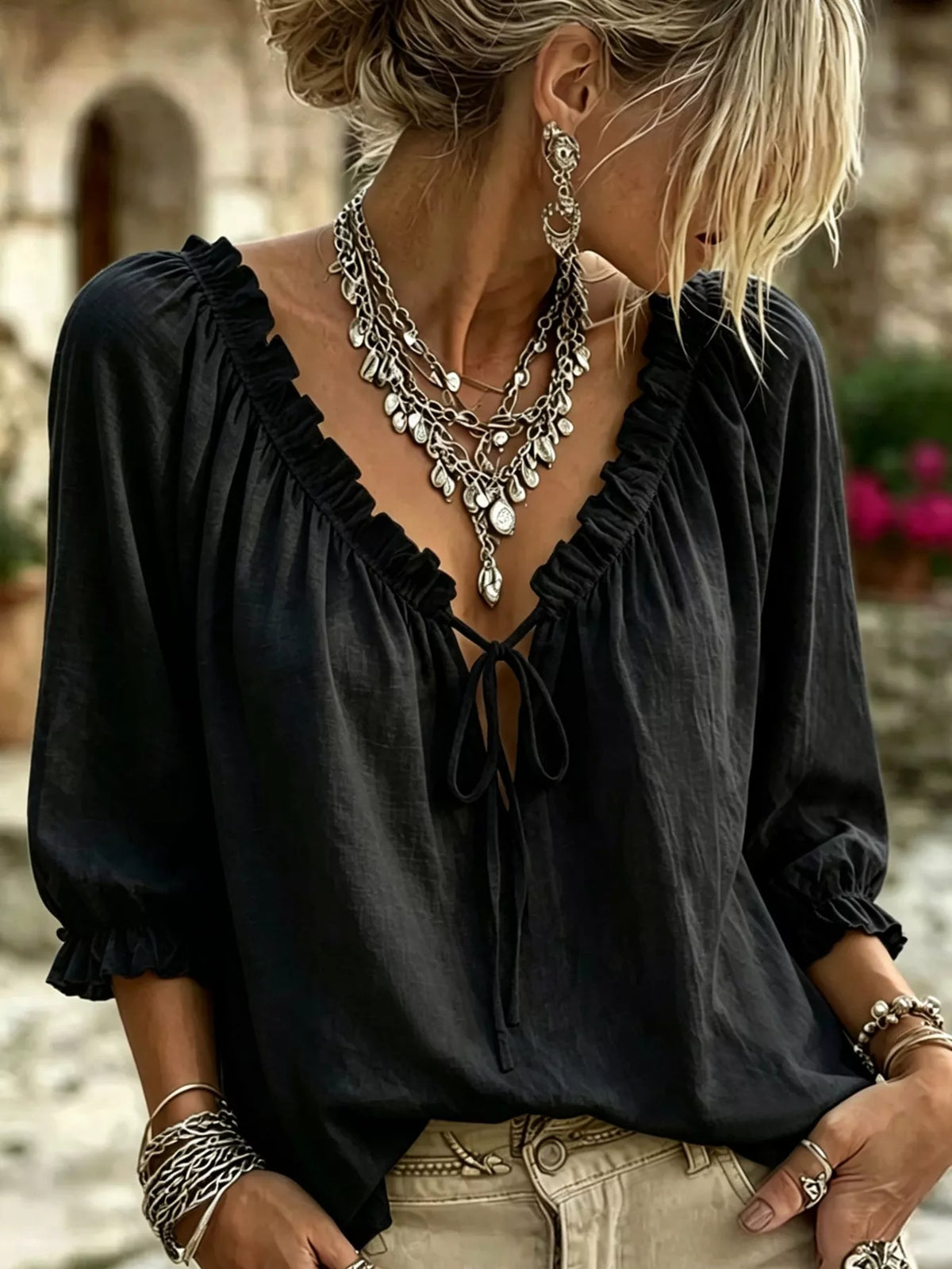 Black frill tie-neck three-quarter sleeve blouse with bow front and ruffle cuffs