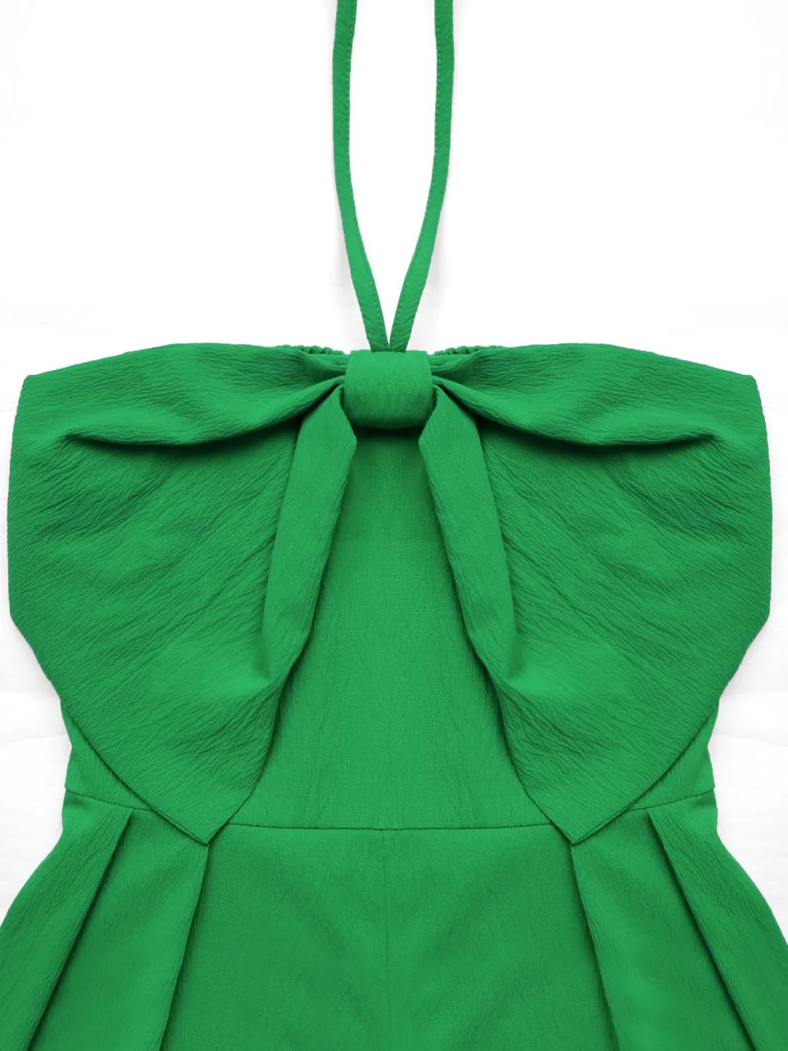 Green halter romper top with oversized fabric bow and smocked bodice