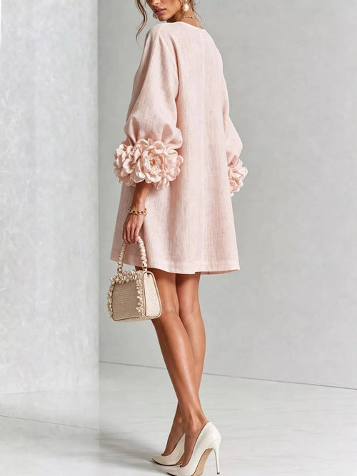 Pink linen-look mini dress with 3D floral puff cuffs and embroidered button placket
