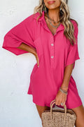 Hot pink half-button collared neck romper with short sleeves and button placket