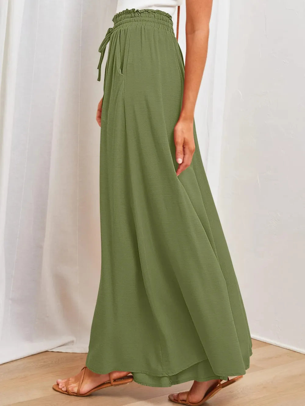 Olive wide-leg pants with elastic waistband, drawstring ties, and side pockets