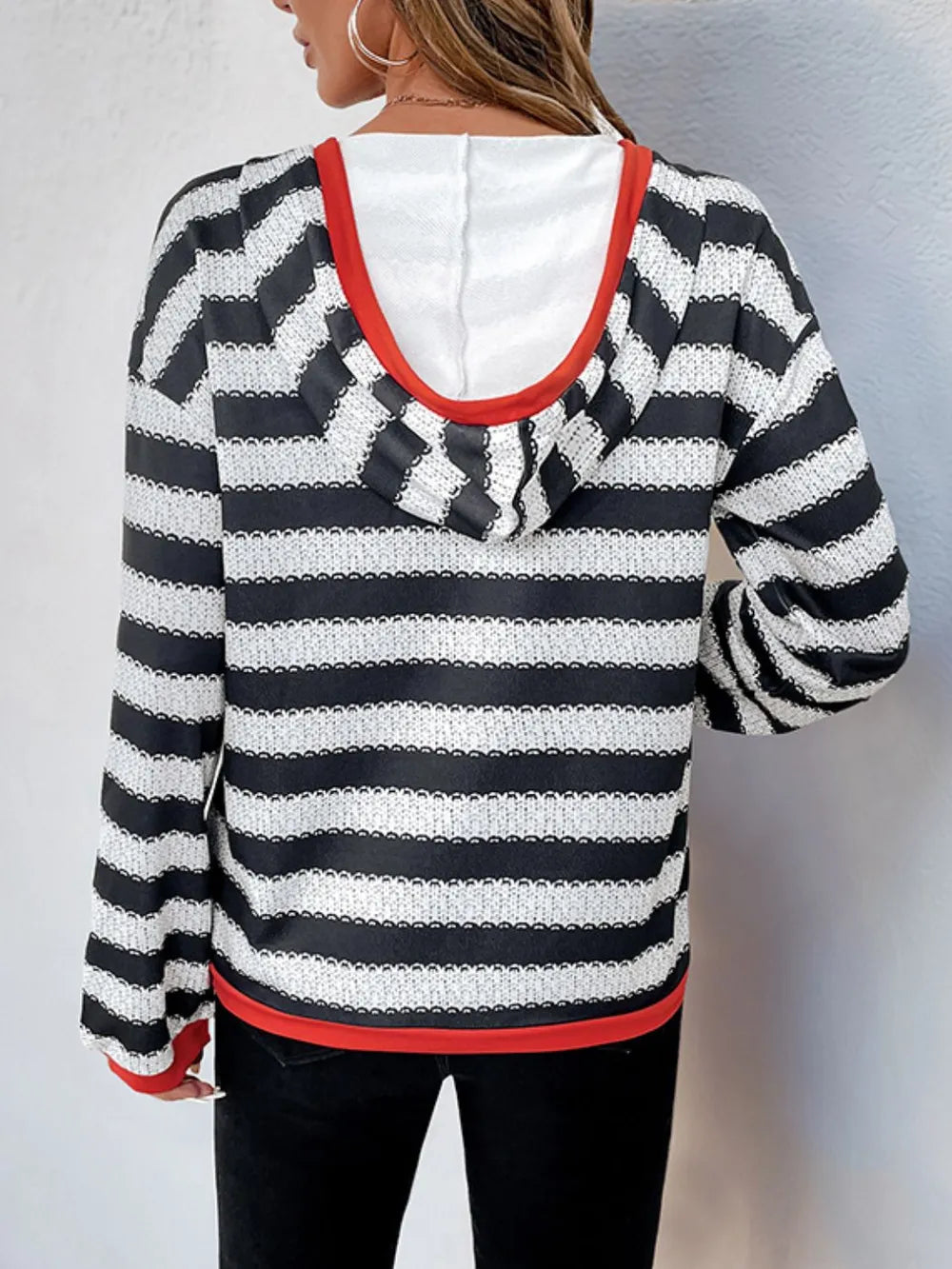 Contrast striped long sleeve hoodie with red-trimmed hood, black-and-white stripes