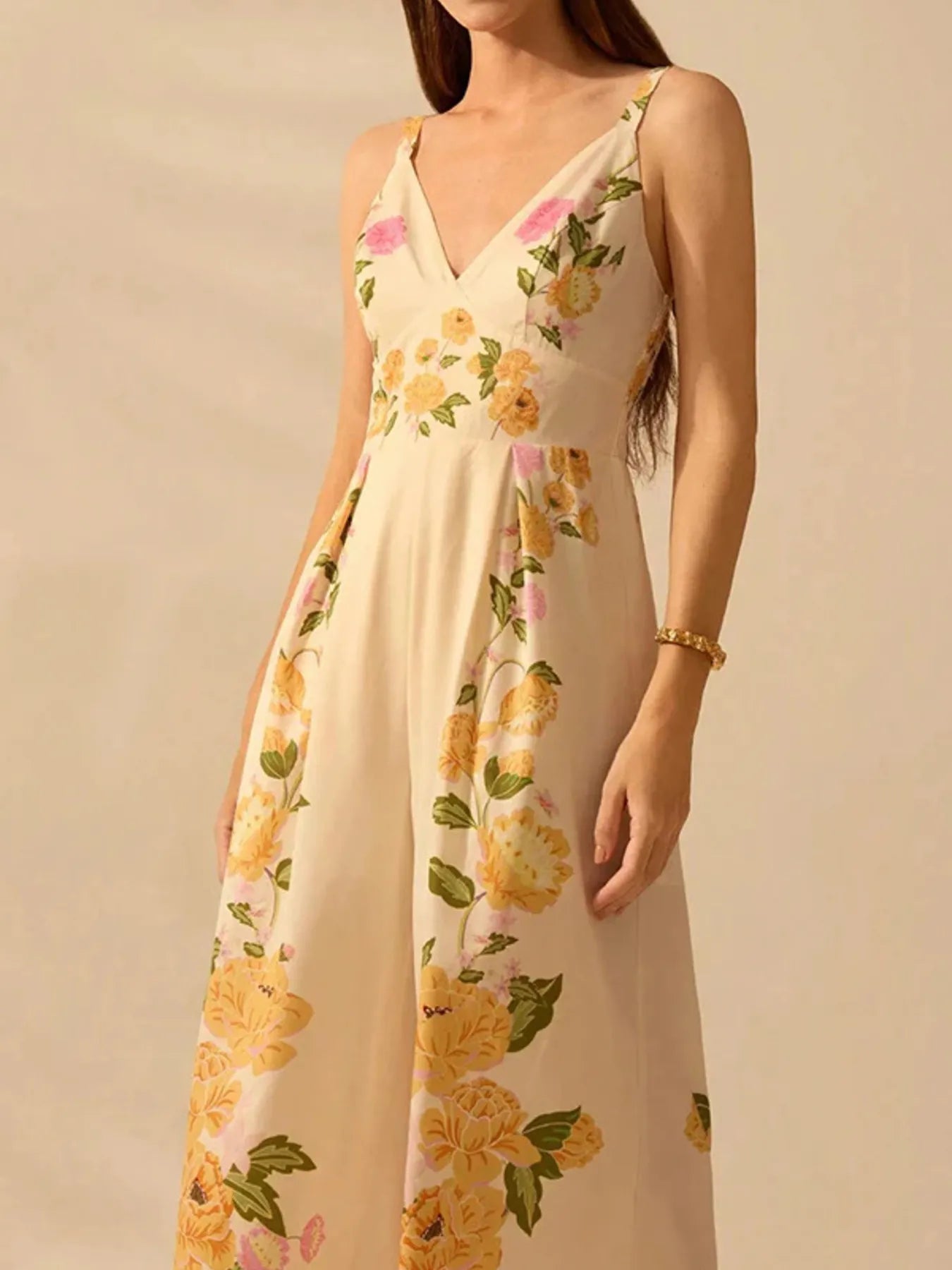 Cream floral V-neck cami jumpsuit with spaghetti straps and wide legs