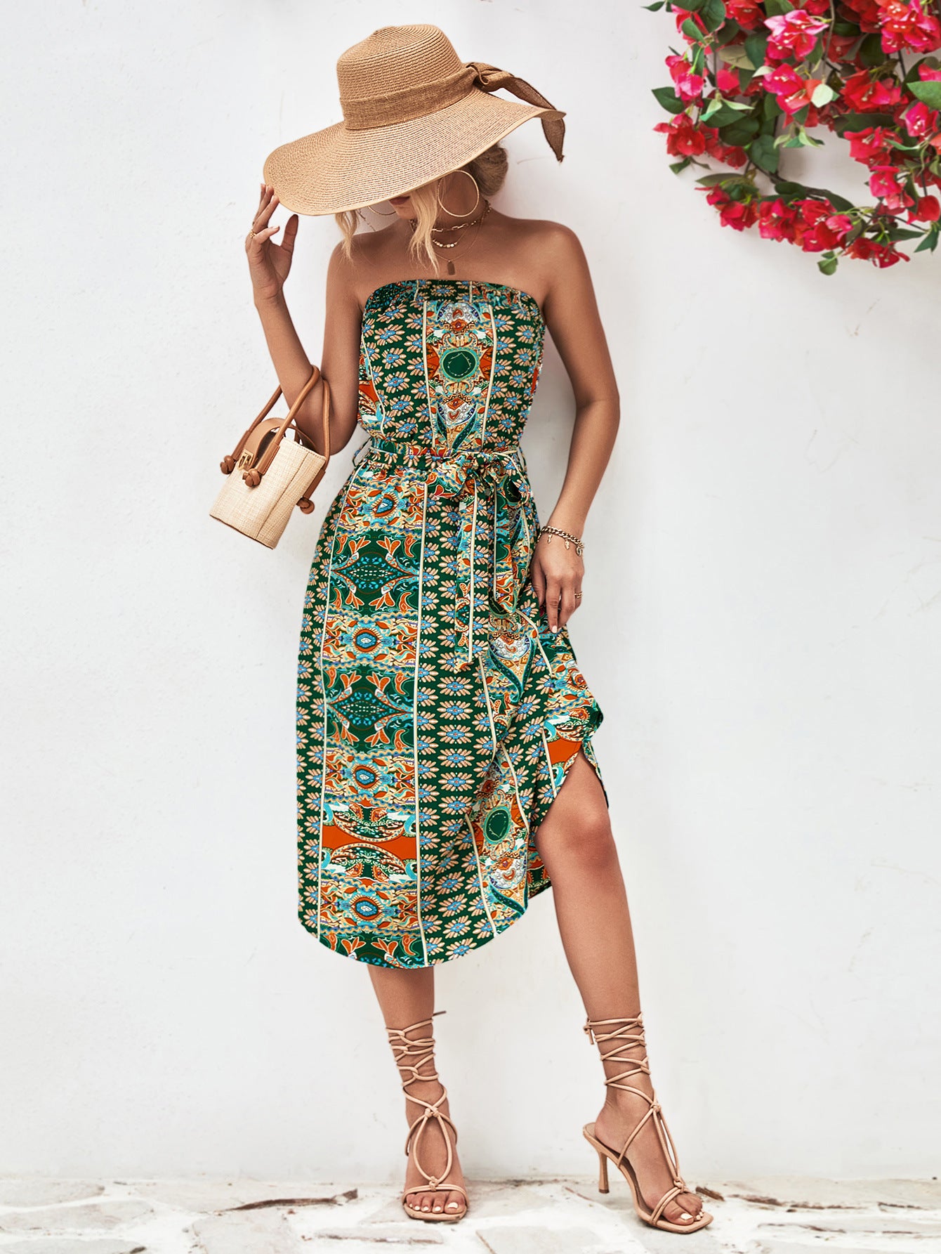 Green strapless tie-belt dress with colorful ornamental print, fitted bodice, midi