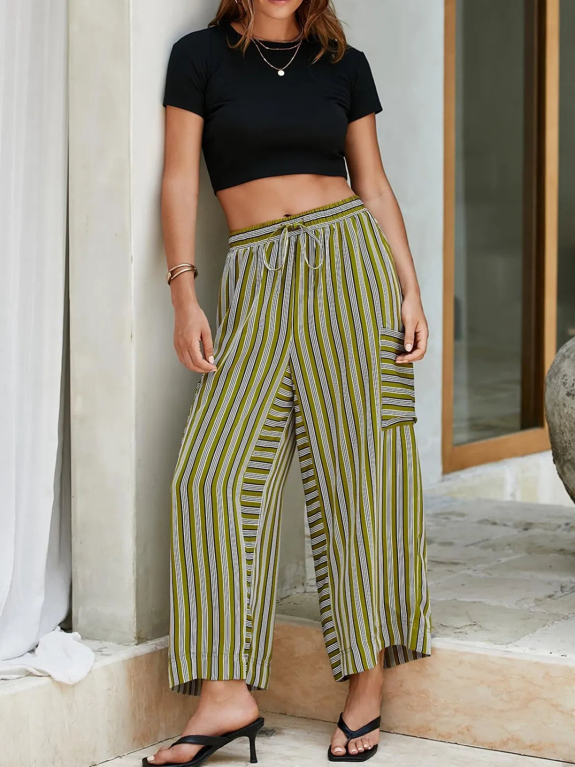 Contrast striped wide-leg pants in moss green with elastic waist and side patch pockets
