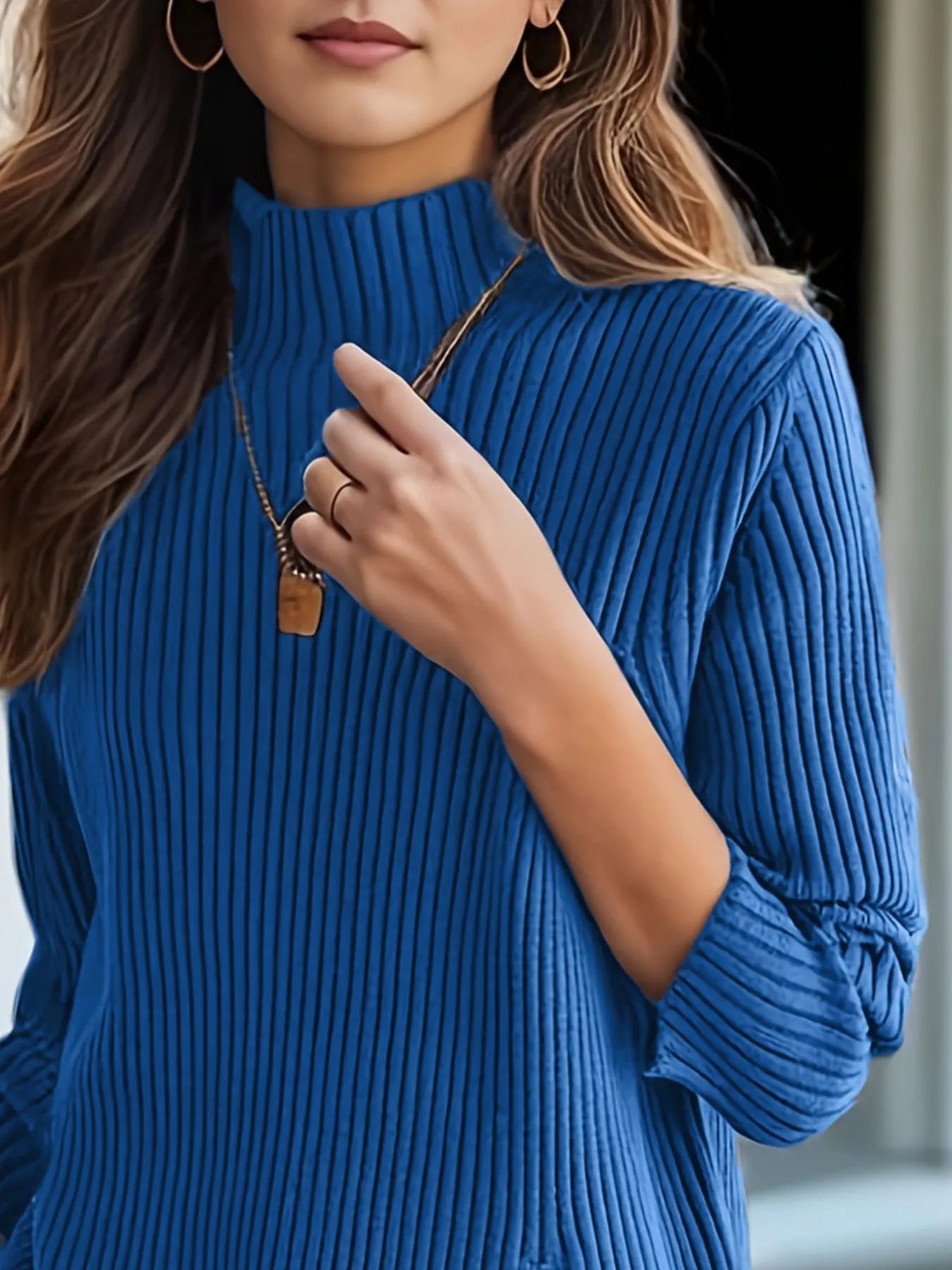Blue ribbed turtleneck sweater with wide neckline and cuffed sleeves