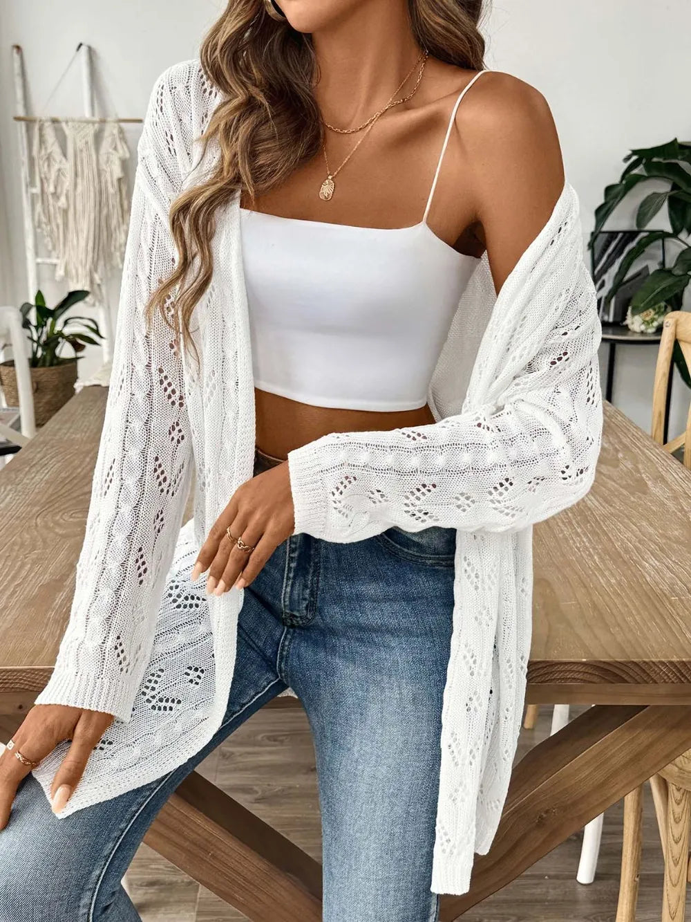 White long-sleeve open-front cardigan with openwork lace texture and relaxed fit.