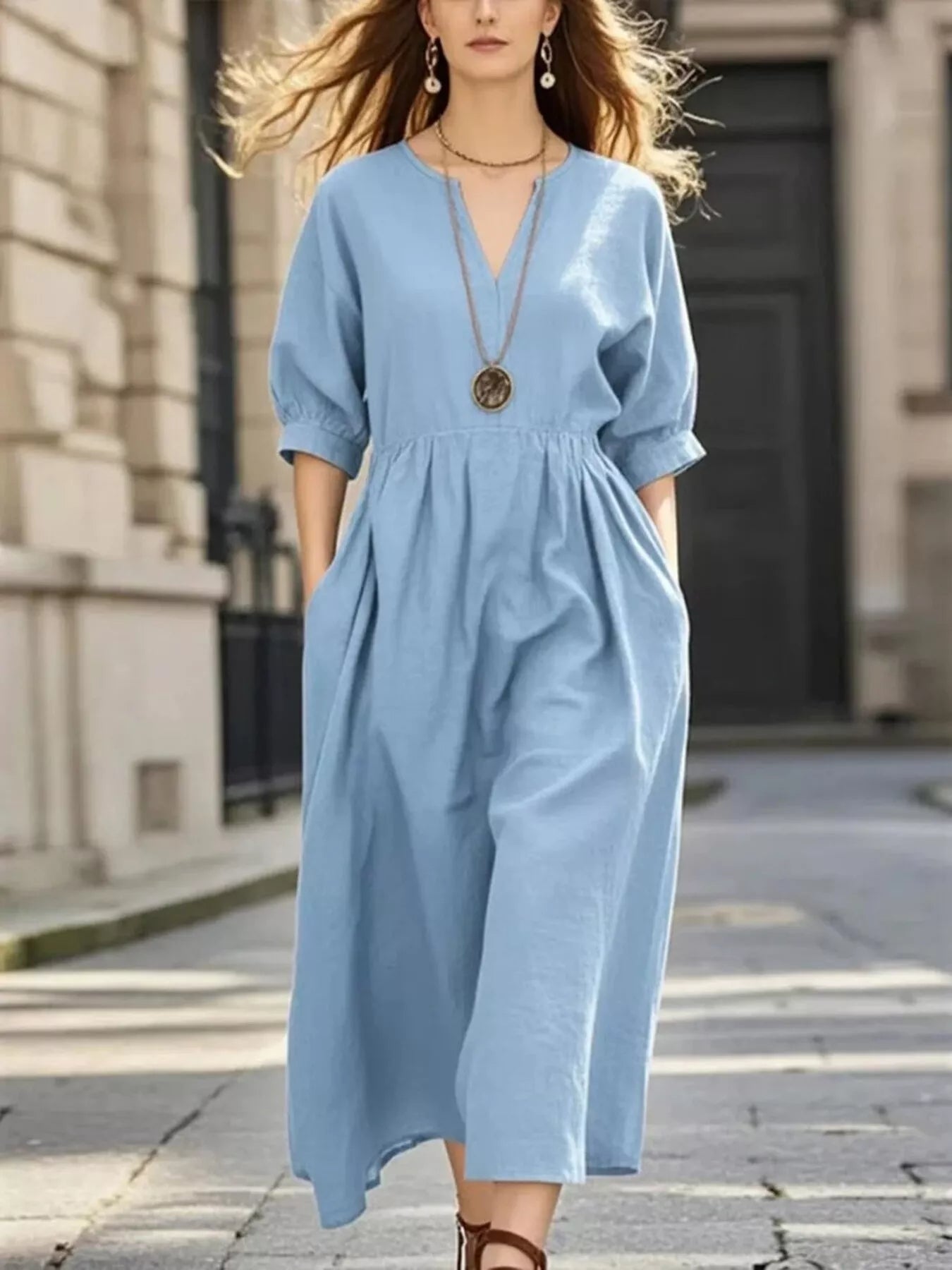 Light blue notched V-neck midi dress with half sleeves and gathered waist